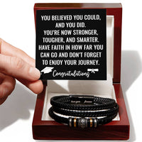 Load image into Gallery viewer, Men's black braided leather cross bracelet for graduate in a luxury mahogany LED box with graduation message card
