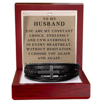 Load image into Gallery viewer, Men's black leather cross bracelet in a luxury mahogany LED box with a romantic message card for husband
