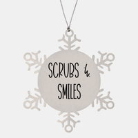 Load image into Gallery viewer, Nurse Christmas Ornament Scrubs &amp; smiles Ornament Appreciation Gift Nurse's Day Coworker Colleague Snowflake Ornament – front view
